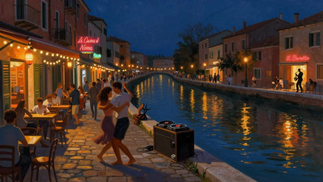 People dancing on cobblestones beside Naviglio Grande canal under string lights and neon signs at midnight.